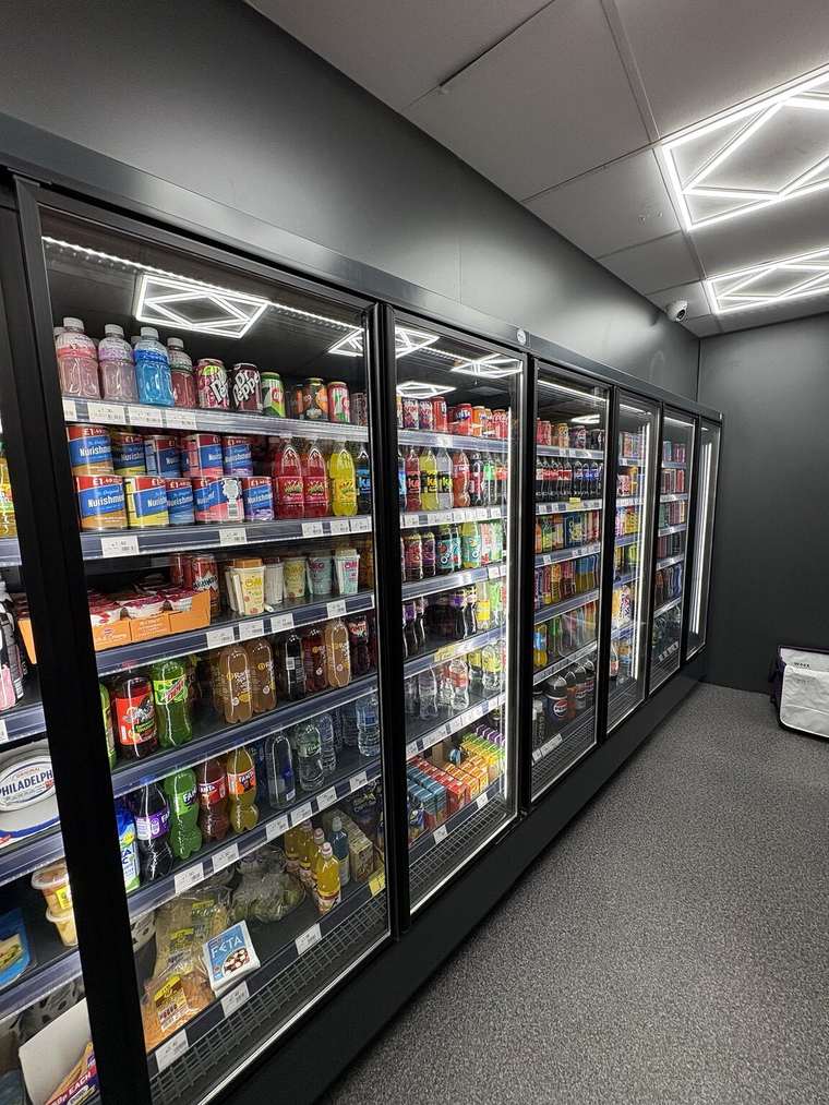 Chilled soft drinks, water, juice and milk drinks in the refrigerators at C&K Local Store.