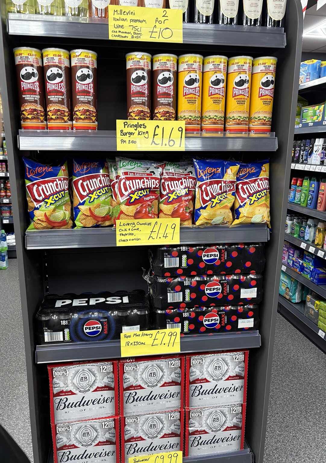 Sharing crisps, soft-drink multipacks and beer offers at C&K Local Store in Worcester.